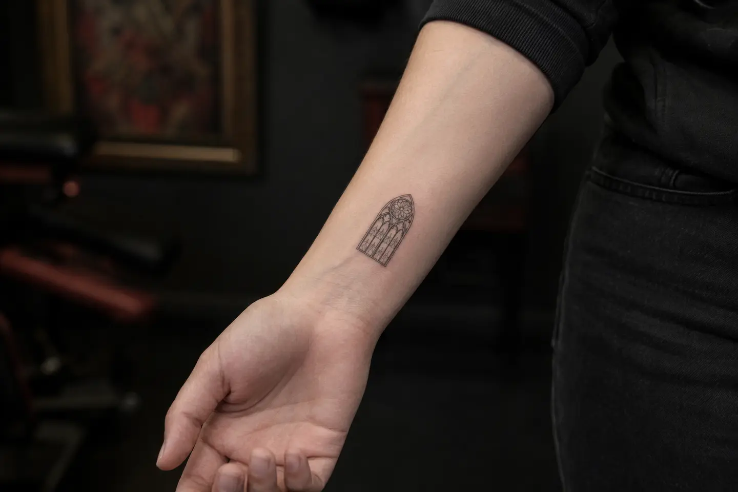 Small gothic cathedral window wrist tattoo
